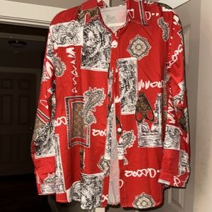 Woman’s blouse buttton up long sleeves multi colored never worn boutique style